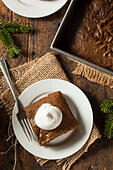 homemade-brown-gingerbread-cake-with-whi