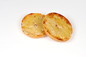 toasted-bagel-with-butter-on-white-backg