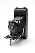 Vintage photographic film camera antique on white cut out.  No. 1A Pocket Kodak  folding camera 1926 - 1932, Rochester - Stock Image