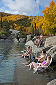 People soaking in the outdoor pool. Chena Hot Springs. Near Fairbanks. Alaska. USA - Stock Image