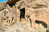 Carved elephants at the entrance of Cave 16, the Ajanta Caves Complex. Maharashta, India - Stock Image